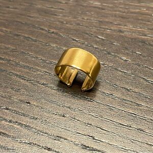 Small wide brass ear cuff gold toned